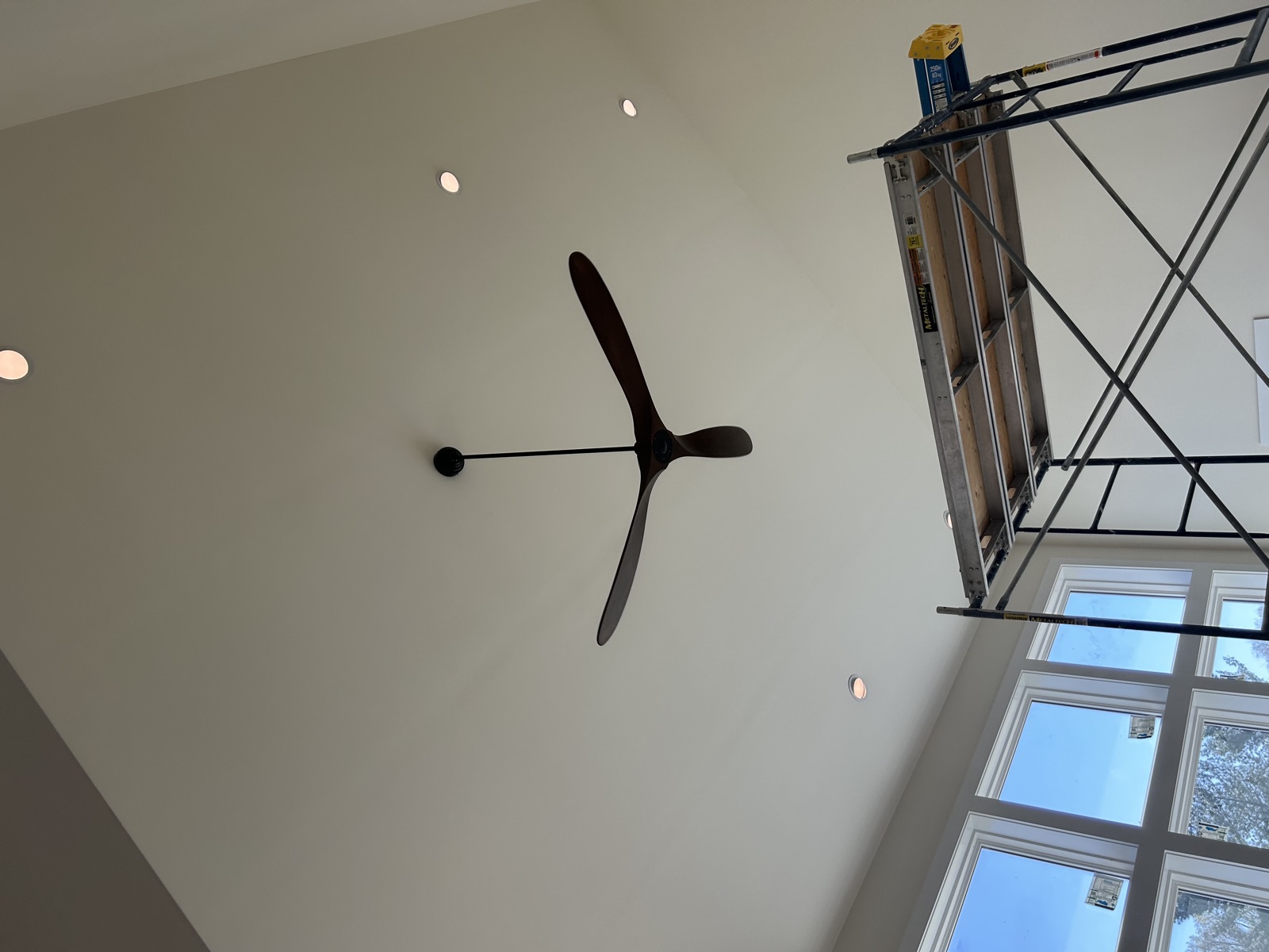 Andrew Holbein, owner of Power to the People, on a job site in his maroon company polo